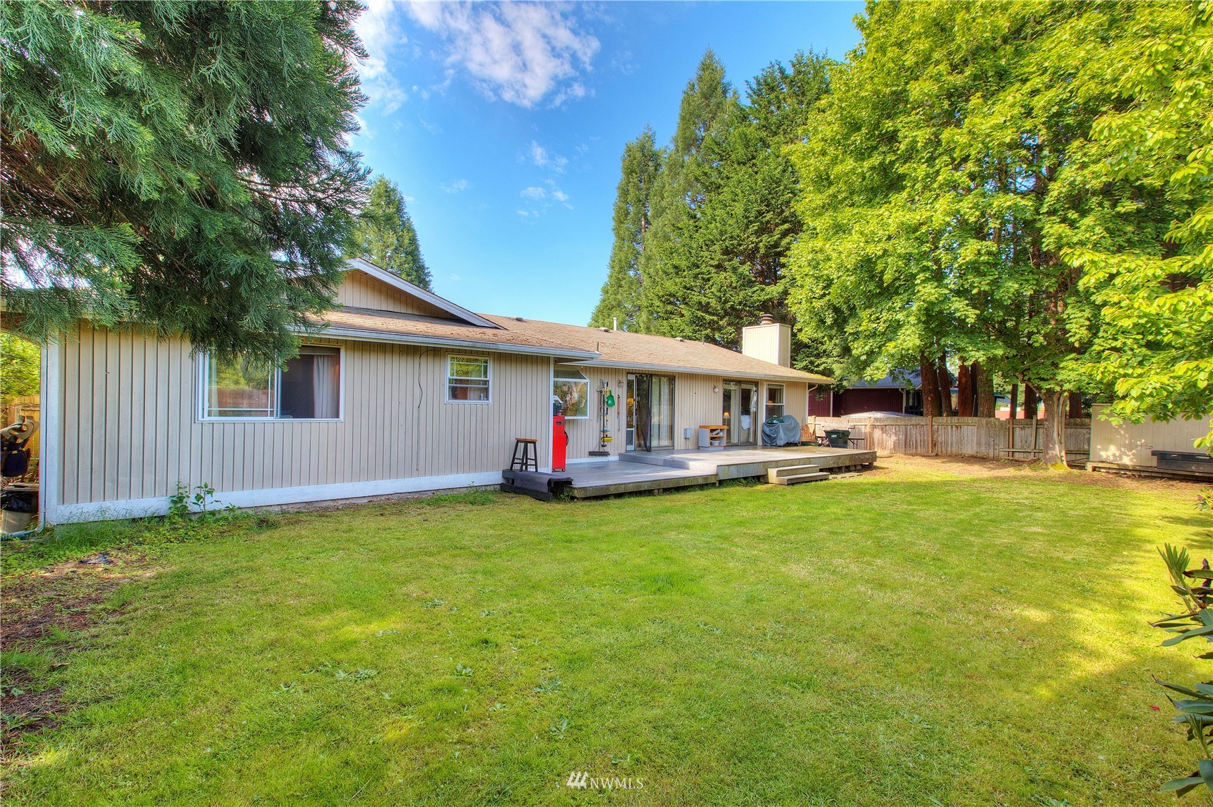 9216 South 239th Street Kent, WA 98031 - Photo 17 of 20 a view of a house with a yard and sitting area