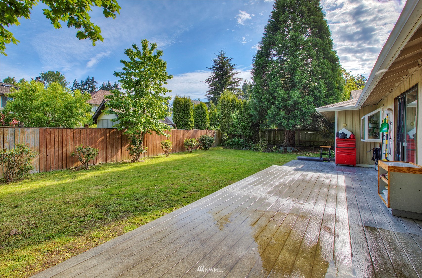 9216 South 239th Street Kent, WA 98031 - Photo 18 of 20 a view of backyard with table and chairs and potted plants