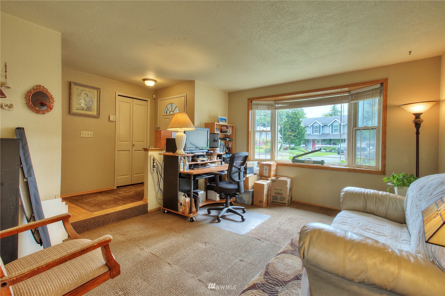 9216 South 239th Street Kent, WA 98031 - Photo 5 of 20 a view of a livingroom with workspace and a window
