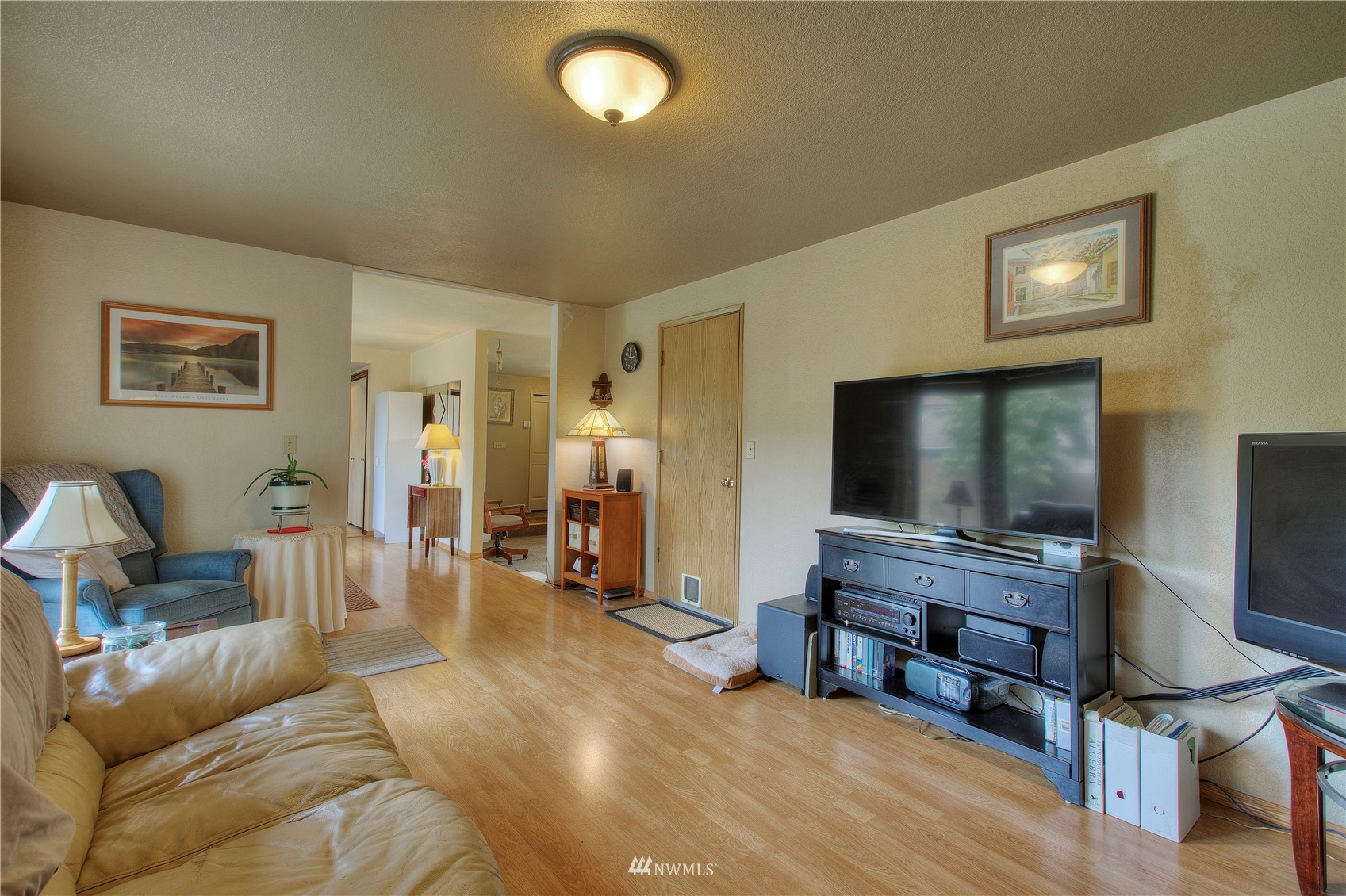 9216 South 239th Street Kent, WA 98031 - Photo 7 of 20 a living room with furniture and a flat screen tv