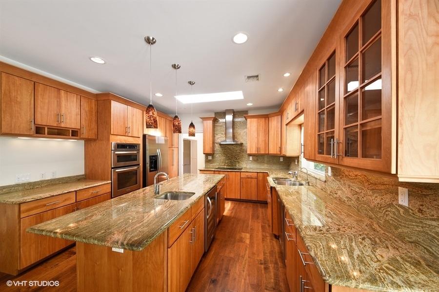 2730 Cardinal Circle Gulf Stream, FL 33483 - Photo 15 of 35 a kitchen with stainless steel appliances granite countertop a sink and counter space