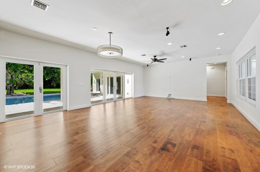 2730 Cardinal Circle Gulf Stream, FL 33483 - Photo 19 of 35 a view of empty room with wooden floor and fan