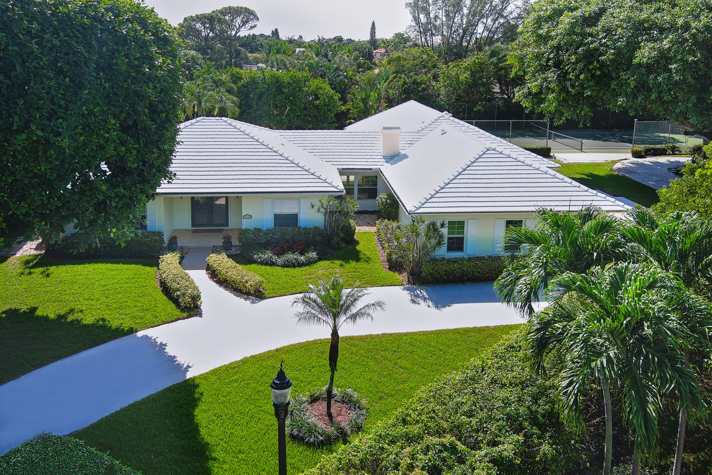 2730 Cardinal Circle Gulf Stream, FL 33483 - Photo 2 of 35 a aerial view of a house with garden