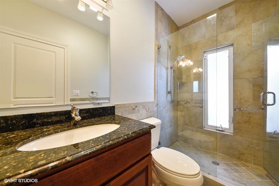 2730 Cardinal Circle Gulf Stream, FL 33483 - Photo 28 of 35 a bathroom with a granite countertop sink mirror vanity and toilet