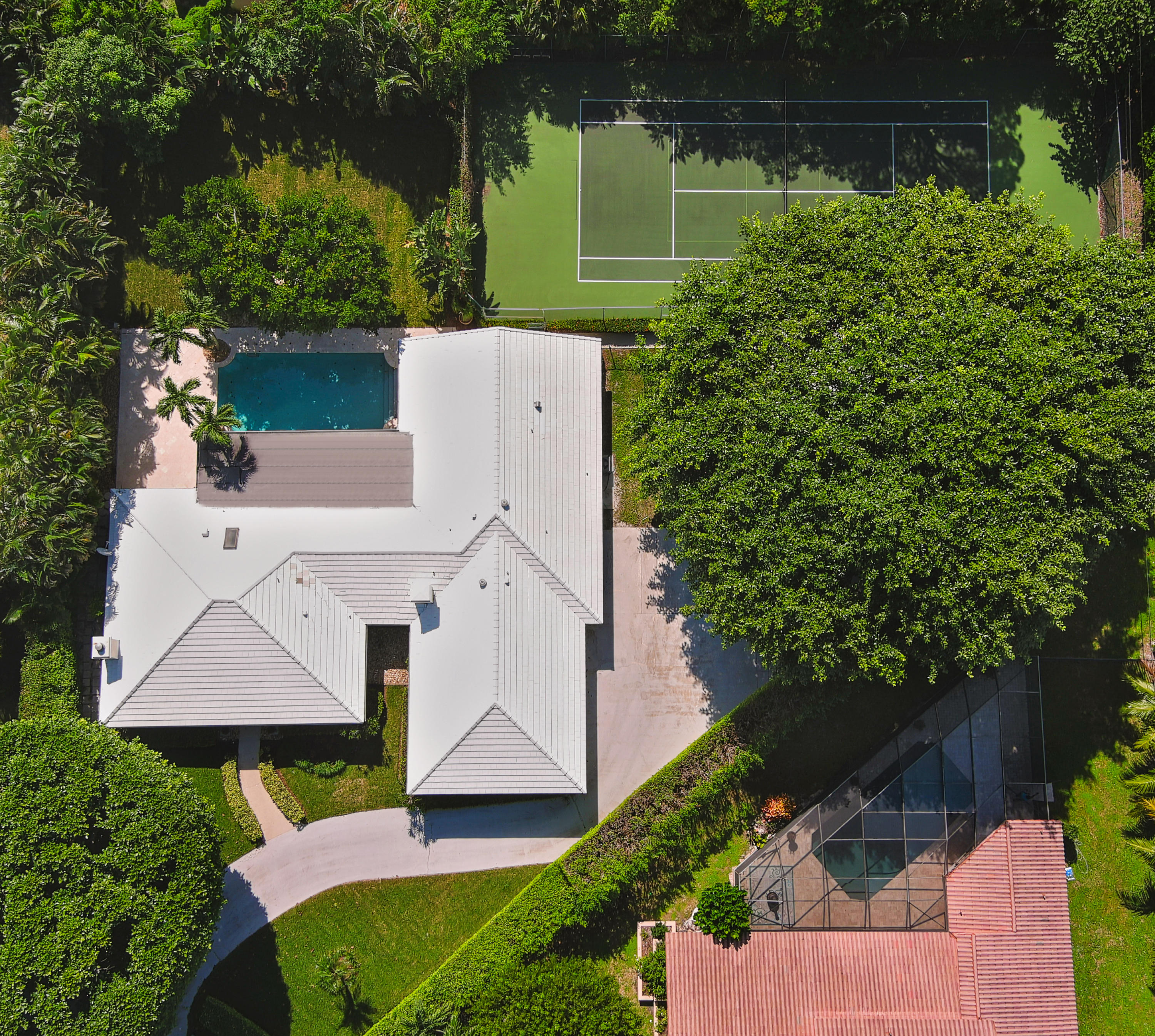 2730 Cardinal Circle Gulf Stream, FL 33483 - Photo 3 of 35 an aerial view of a house with a yard and lake view