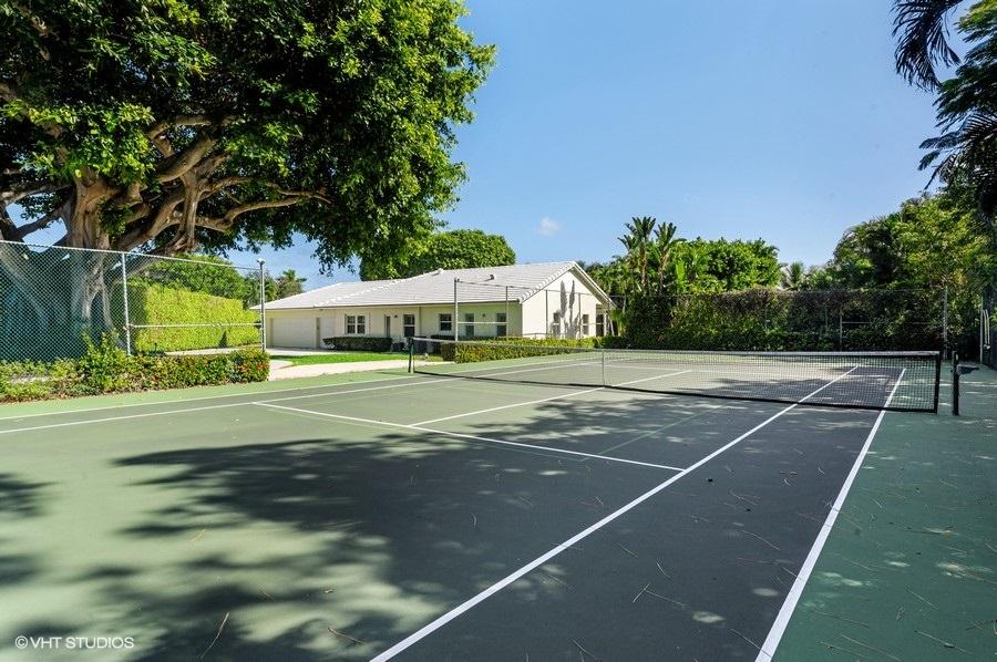 2730 Cardinal Circle Gulf Stream, FL 33483 - Photo 34 of 35 a view of a tennis ground with large trees