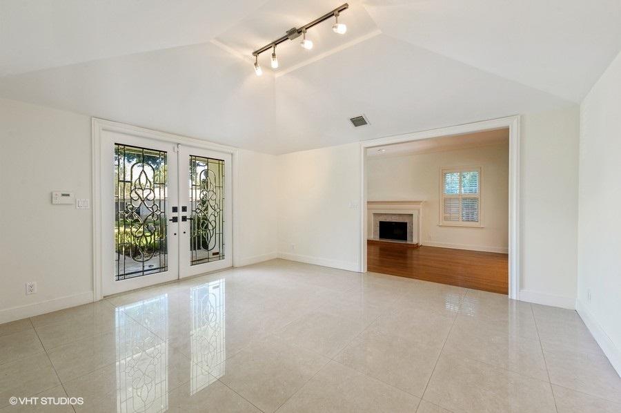 2730 Cardinal Circle Gulf Stream, FL 33483 - Photo 8 of 35 an empty room with windows and fireplace
