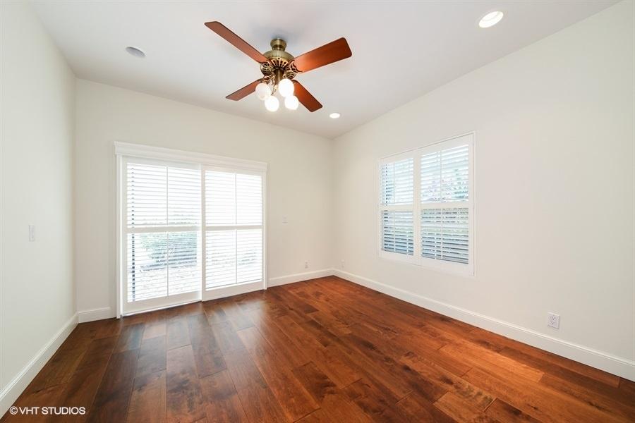 2730 Cardinal Circle Gulf Stream, FL 33483 - Photo 9 of 35 an empty room with wooden floor fan and windows