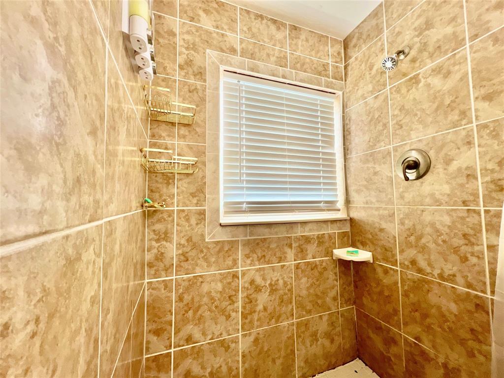 133 Northeast 1st Street Satellite Beach, FL 32937 - Photo 14 of 27 a bathroom with a shower