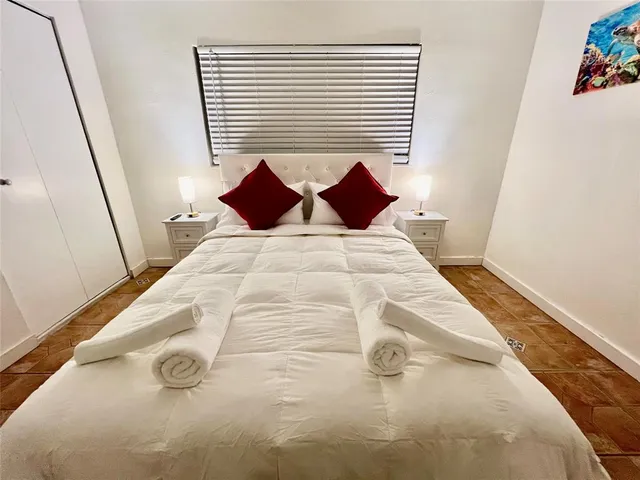 a view of a bedroom with baby bed
