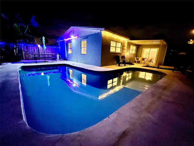 a view of a swimming pool with an outdoor space
