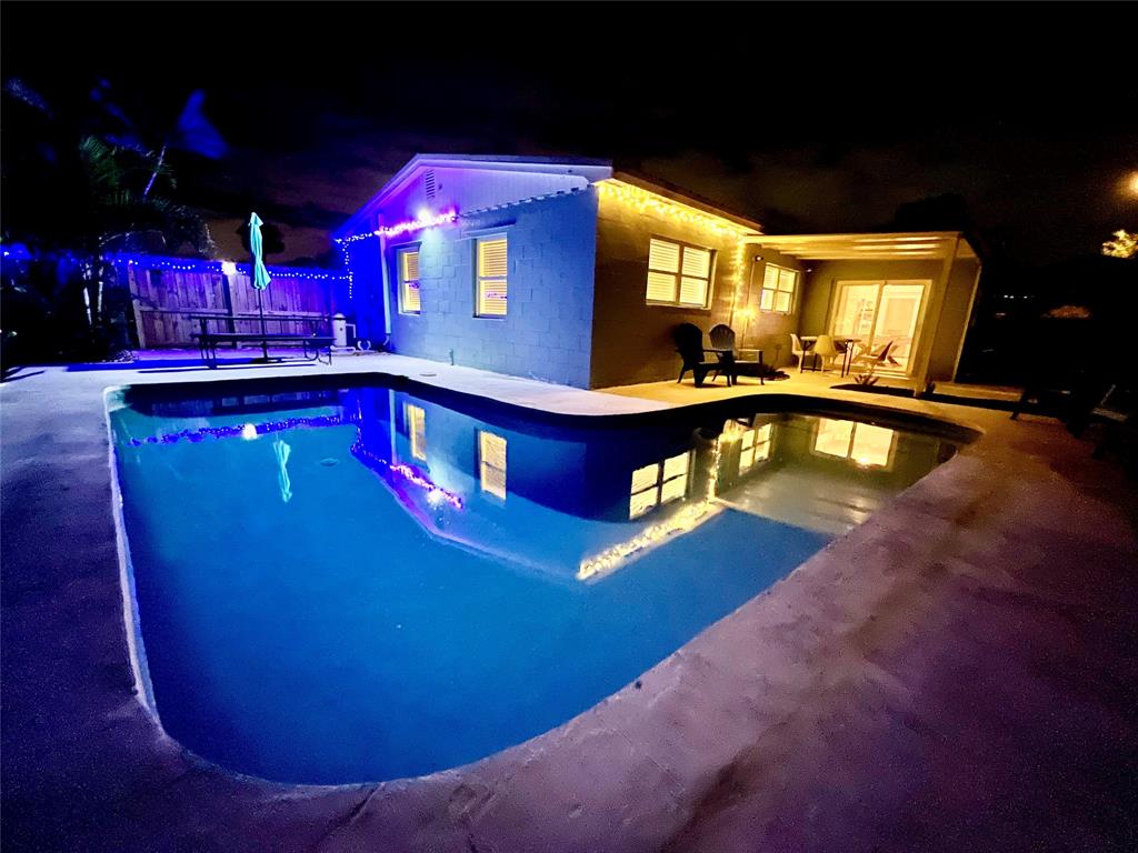 133 Northeast 1st Street Satellite Beach, FL 32937 - Photo 23 of 27 a view of a swimming pool with an outdoor space