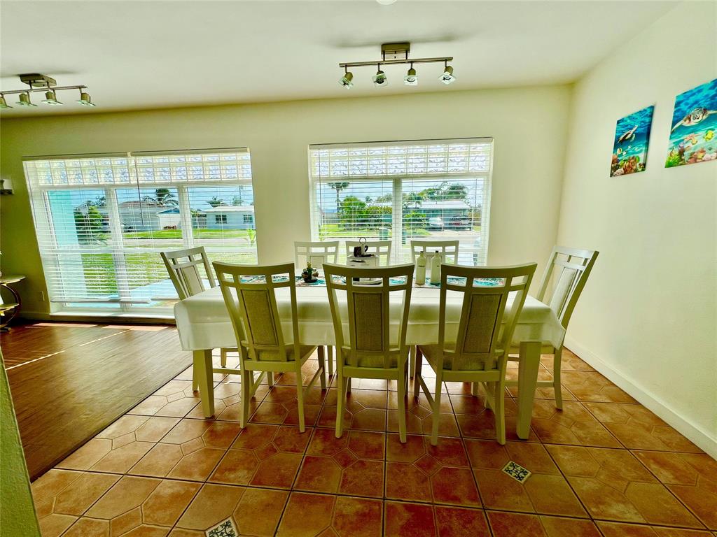 133 Northeast 1st Street Satellite Beach, FL 32937 - Photo 6 of 27 a view of a dining room with furniture window and outside view