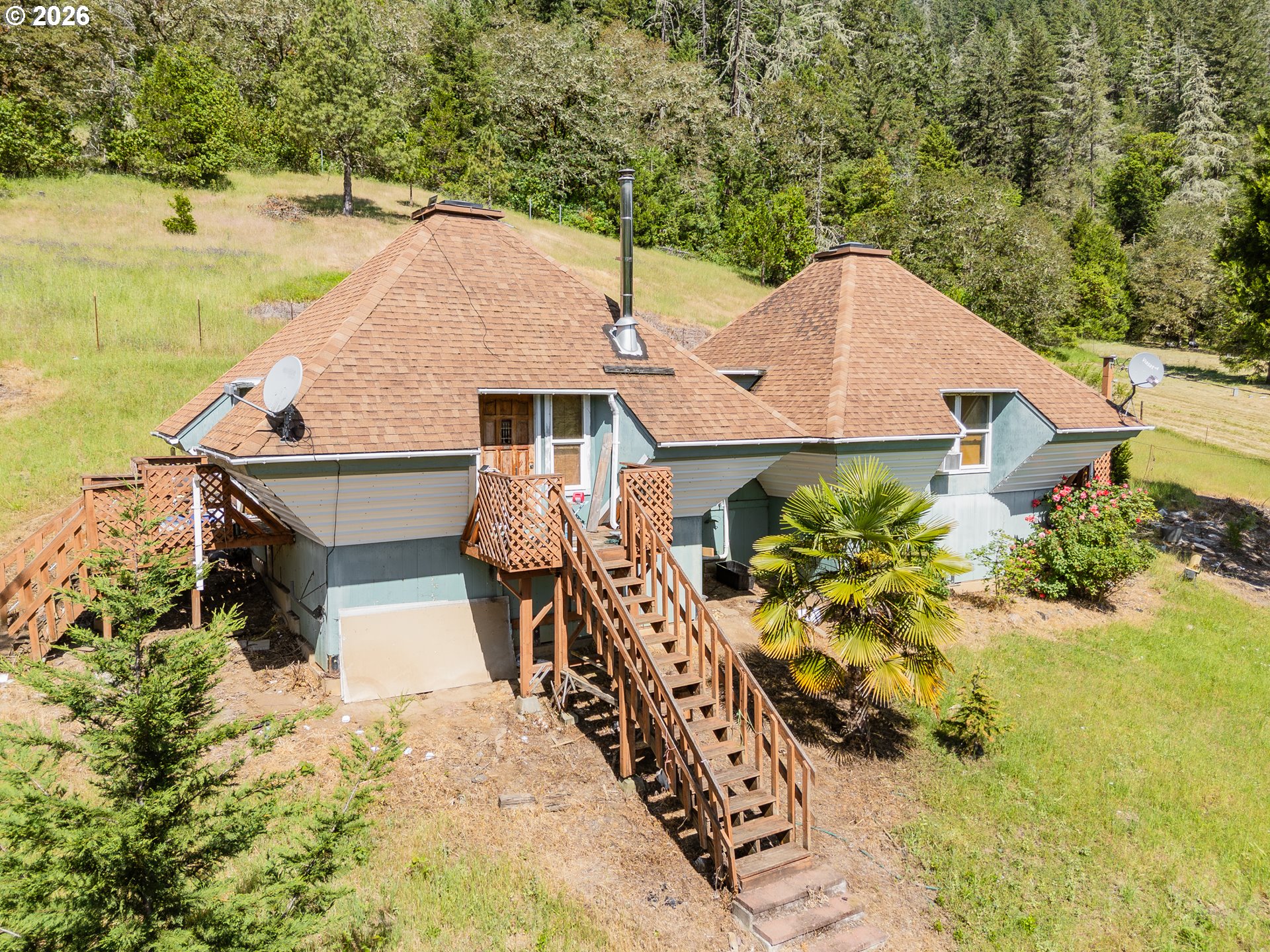 3707 Willis Creek Road Winston, OR 97496 - Photo 2 of 30 an aerial view of a house with swimming pool and lake view