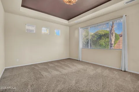 a kitchen with granite countertop white cabinets and stainless steel appliances