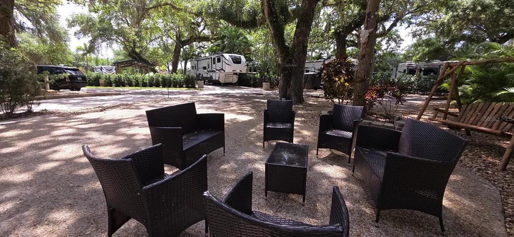 400 Longhorn Drive River Ranch, FL 33867 - Photo 5 of 10 a terrace with outdoor seating and trees