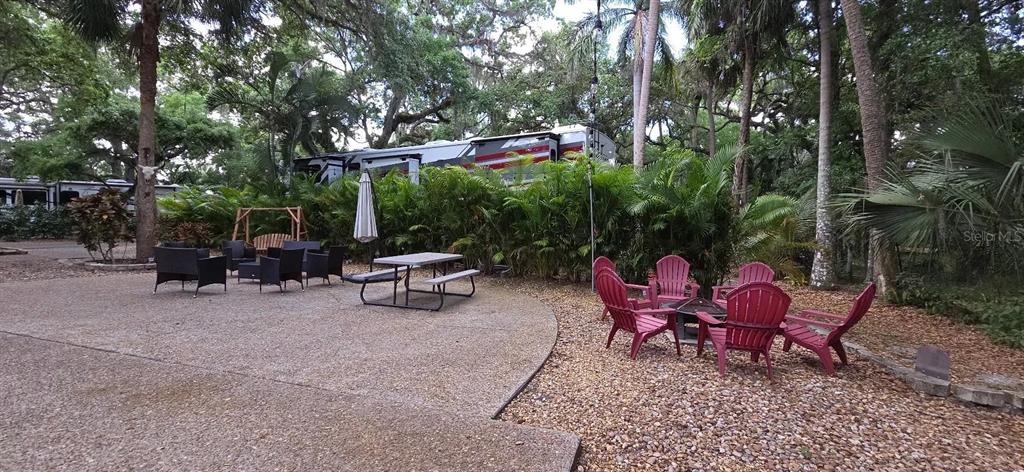 400 Longhorn Drive River Ranch, FL 33867 - Photo 6 of 10 a view of a chairs and tables in the back yard of the house