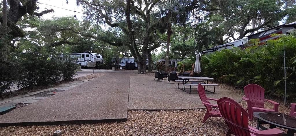 400 Longhorn Drive River Ranch, FL 33867 - Photo 9 of 10 a view of backyard with outdoor seating and trees