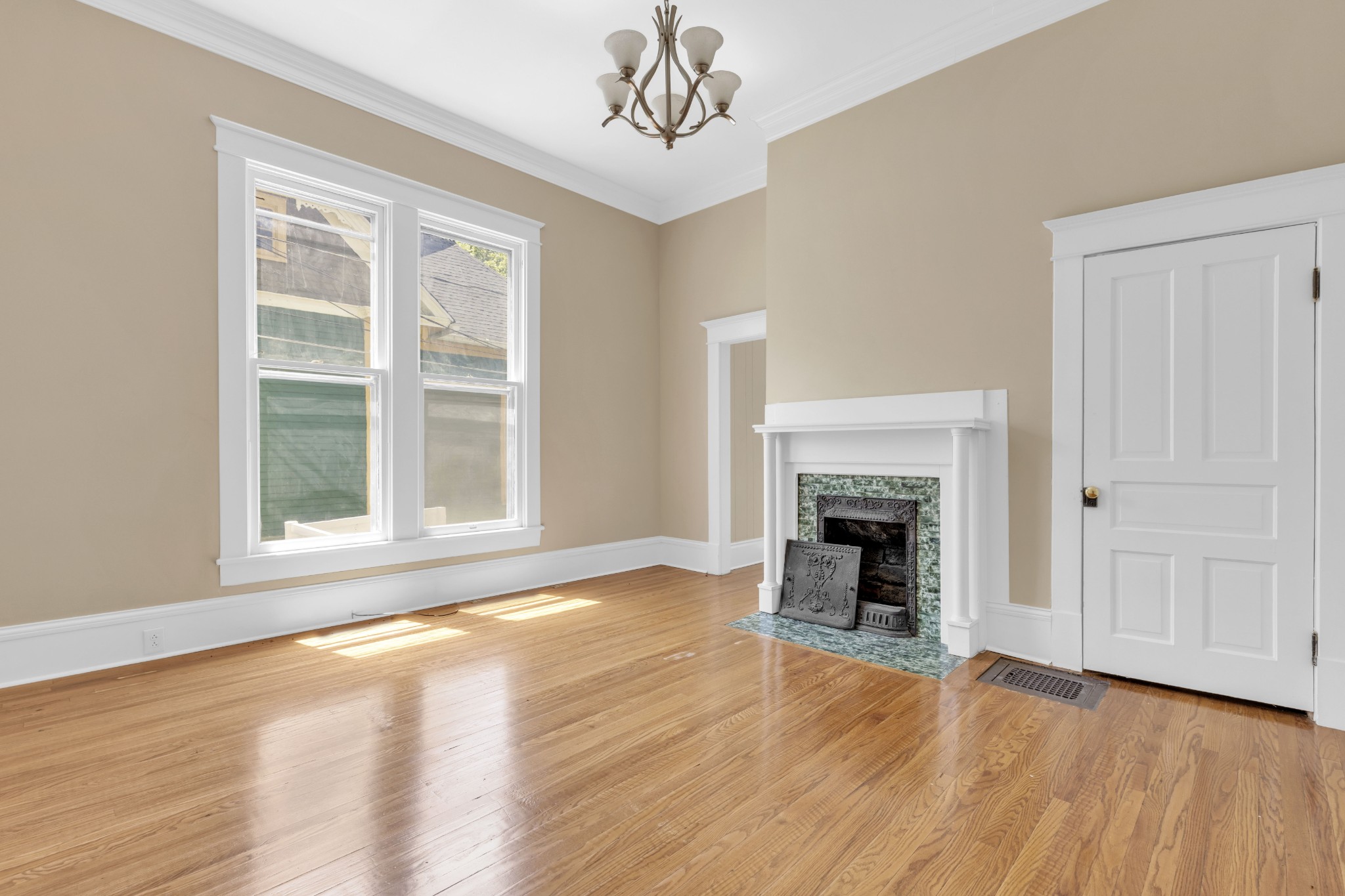 115 North Main Street Springfield, TN 37172 - Photo 14 of 24 a view of an empty room with wooden floor fireplace and a window