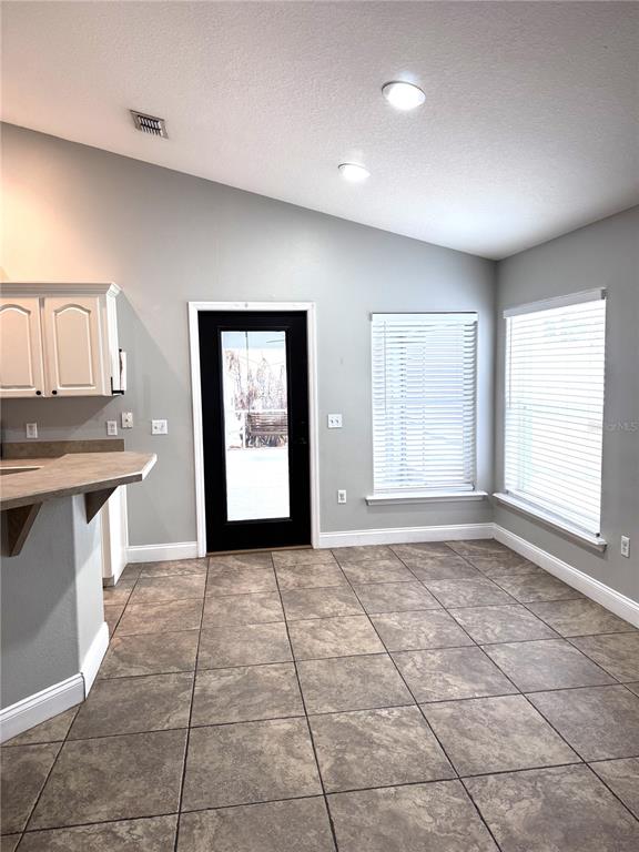 2616 Hickory View Loop Lakeland, FL 33813 - Photo 13 of 39 a view of a kitchen with a sink and a window