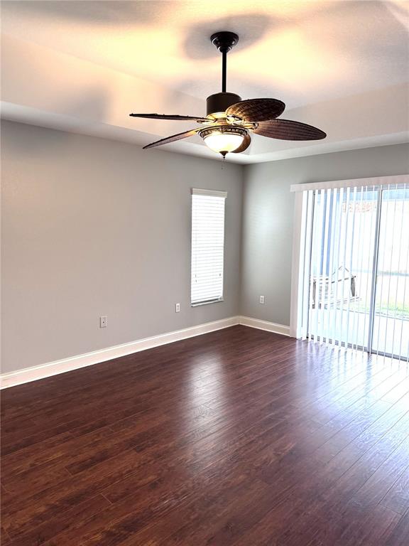 2616 Hickory View Loop Lakeland, FL 33813 - Photo 19 of 39 a view of an empty room with wooden floor and a window