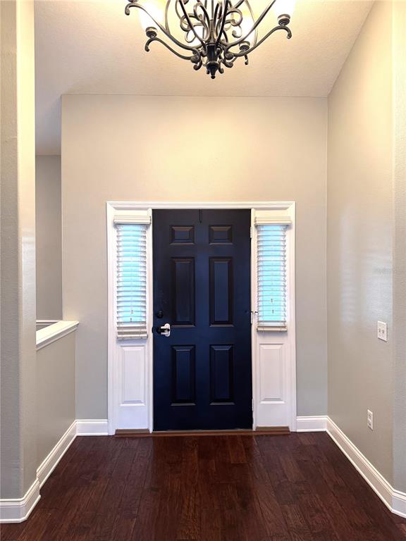 2616 Hickory View Loop Lakeland, FL 33813 - Photo 2 of 39 an empty room with wooden floor and windows