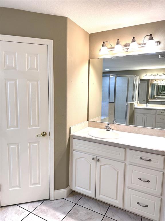 2616 Hickory View Loop Lakeland, FL 33813 - Photo 25 of 39 a bathroom with a sink and a mirror