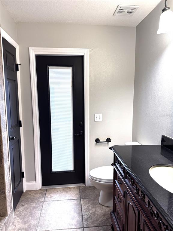 2616 Hickory View Loop Lakeland, FL 33813 - Photo 28 of 39 a bathroom with a toilet a sink and mirror