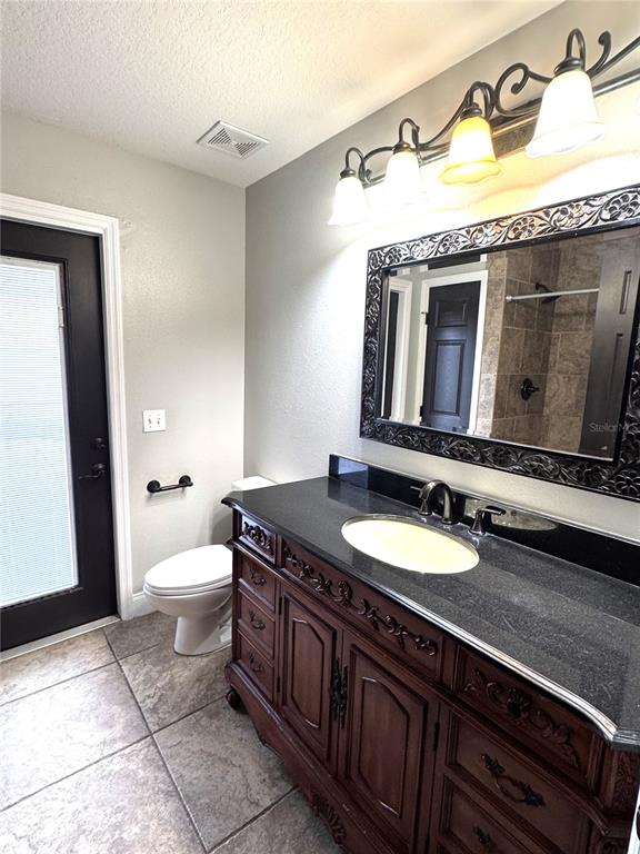 2616 Hickory View Loop Lakeland, FL 33813 - Photo 30 of 39 a bathroom with a granite countertop double vanity sink and mirror