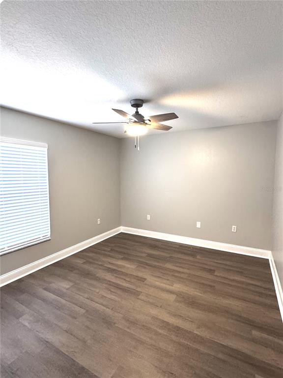 2616 Hickory View Loop Lakeland, FL 33813 - Photo 31 of 39 wooden floor in an empty room with a window