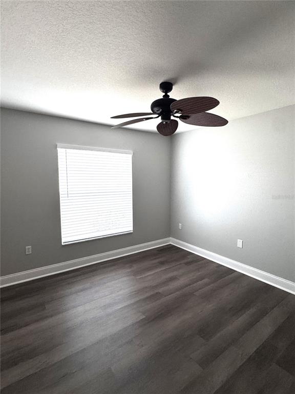 2616 Hickory View Loop Lakeland, FL 33813 - Photo 35 of 39 a view of an empty room with a window and wooden floor
