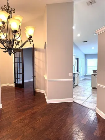 a view of a living room and a chandelier