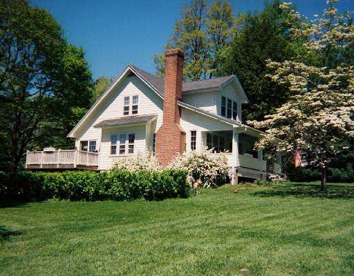 8 Stuart Road West Bridgewater, CT 06752 - Photo 1 of 1 a front view of house with garden