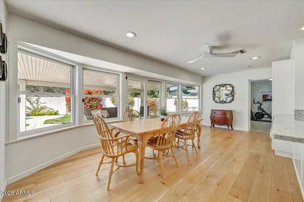 a view of a dining room with furniture window and wooden floor