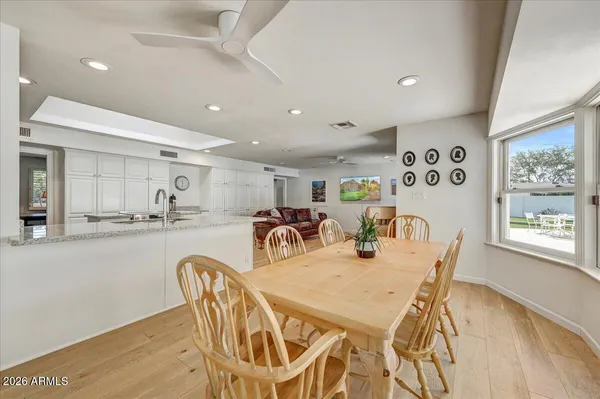 a dining room with furniture and window