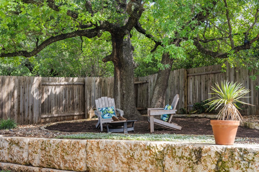 308 Morning Ridge Georgetown, TX 78628 - Photo 17 of 33 Beautiful backyard featuring mature shade trees and natural landscaping.