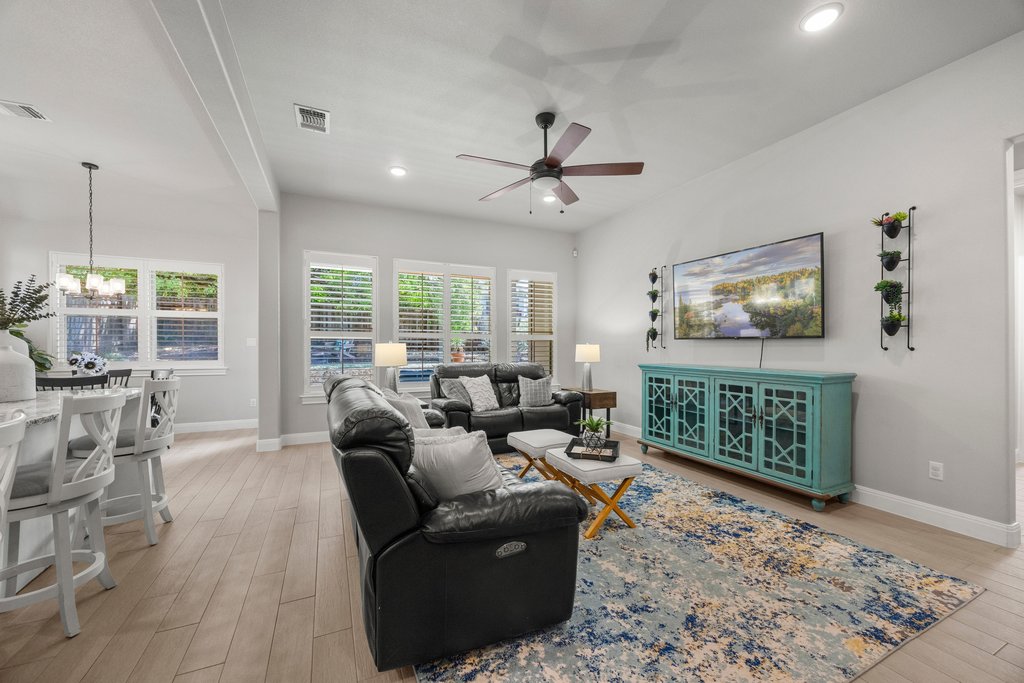 308 Morning Ridge Georgetown, TX 78628 - Photo 20 of 33 a living room with furniture a window and a rug