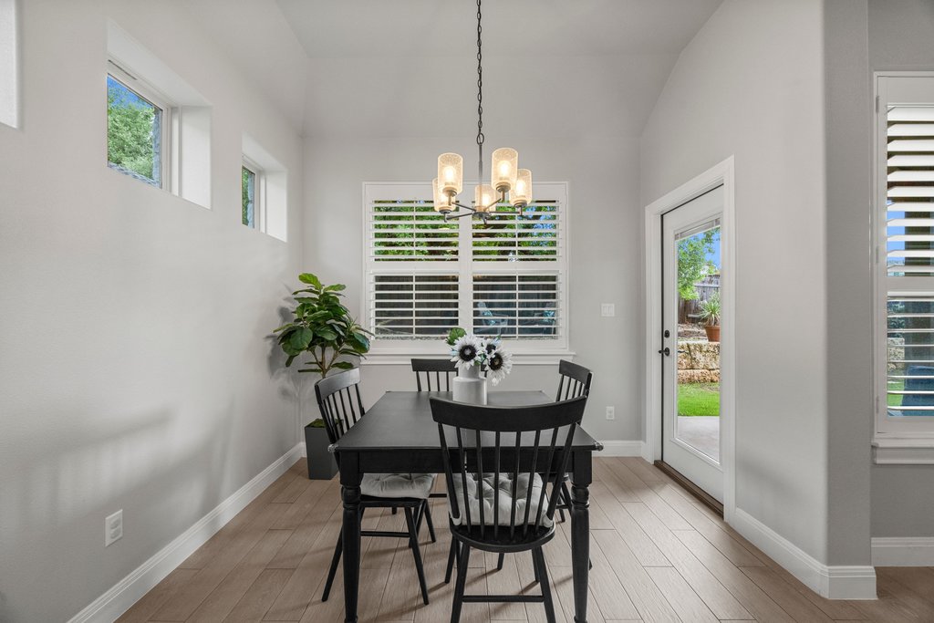 308 Morning Ridge Georgetown, TX 78628 - Photo 22 of 33 a view of a dining room with furniture window and wooden floor