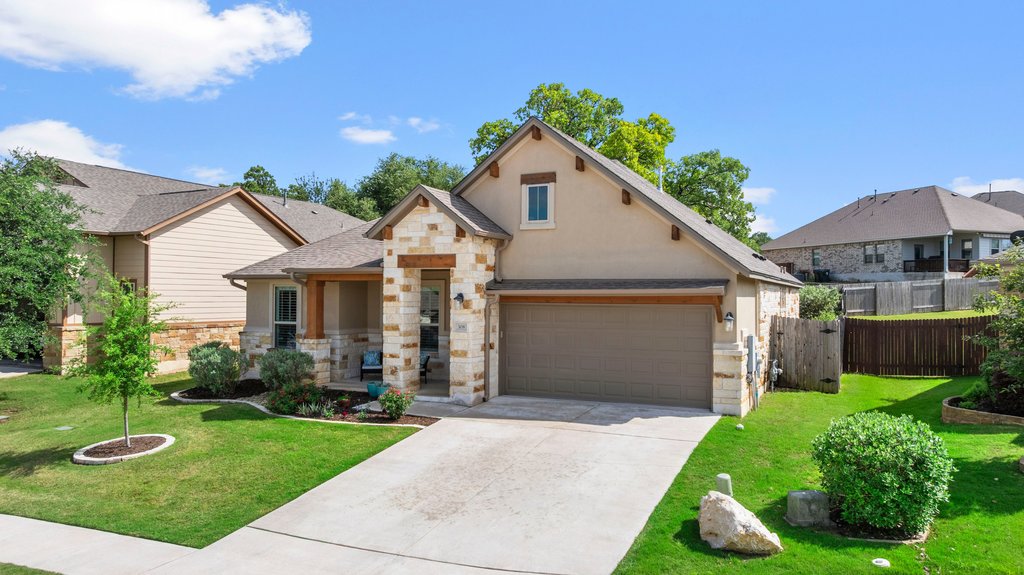 308 Morning Ridge Georgetown, TX 78628 - Photo 31 of 33 a front view of a house with garden