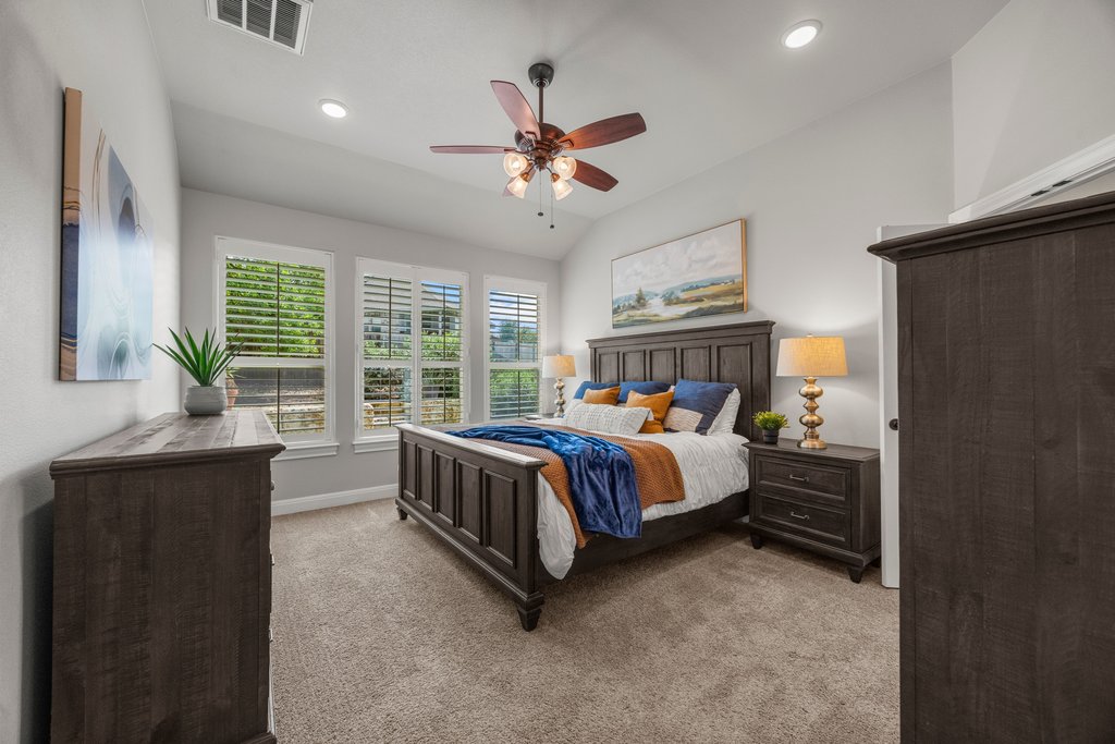 308 Morning Ridge Georgetown, TX 78628 - Photo 5 of 33 a bed sitting in a spacious bedroom next to a window