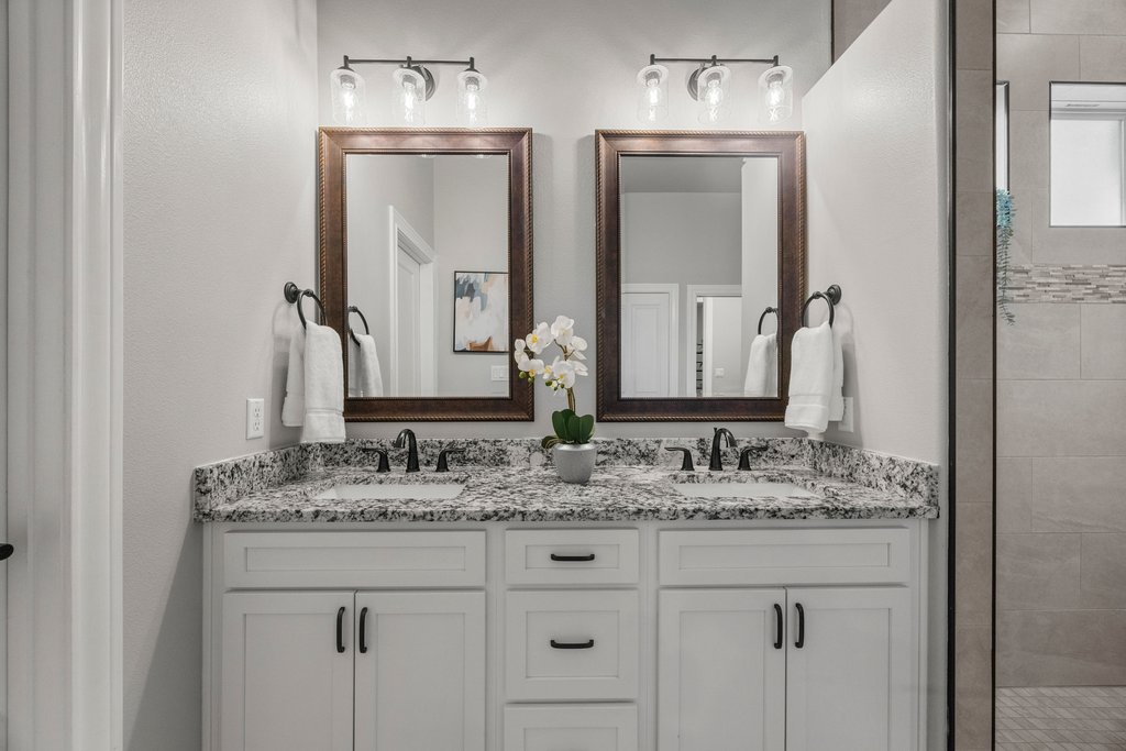 308 Morning Ridge Georgetown, TX 78628 - Photo 7 of 33 a bathroom with double sink and a mirror