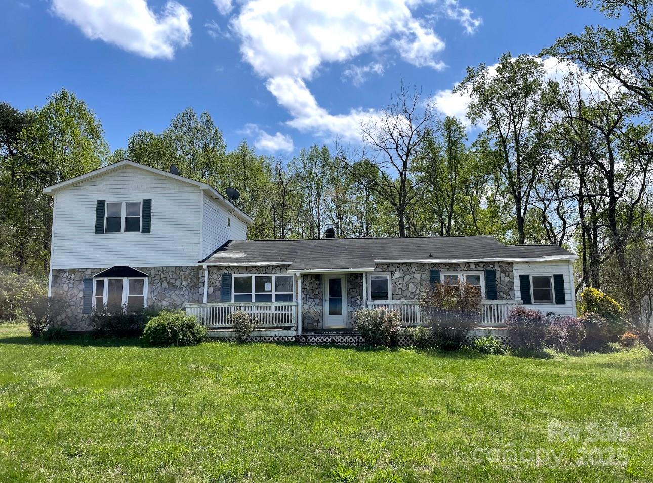 1088 Ramie Mitchell Road Hiddenite, NC 28636 - Photo 1 of 16 front view of a house with a yard