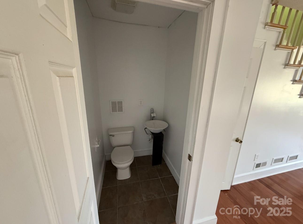 1088 Ramie Mitchell Road Hiddenite, NC 28636 - Photo 16 of 16 a bathroom with a sink and a toilet