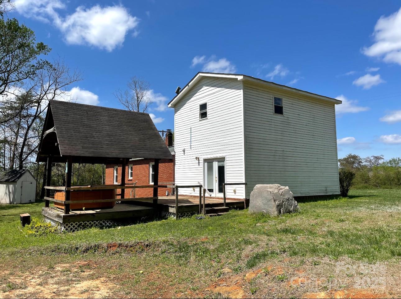 1088 Ramie Mitchell Road Hiddenite, NC 28636 - Photo 3 of 16 a view of a house with backyard
