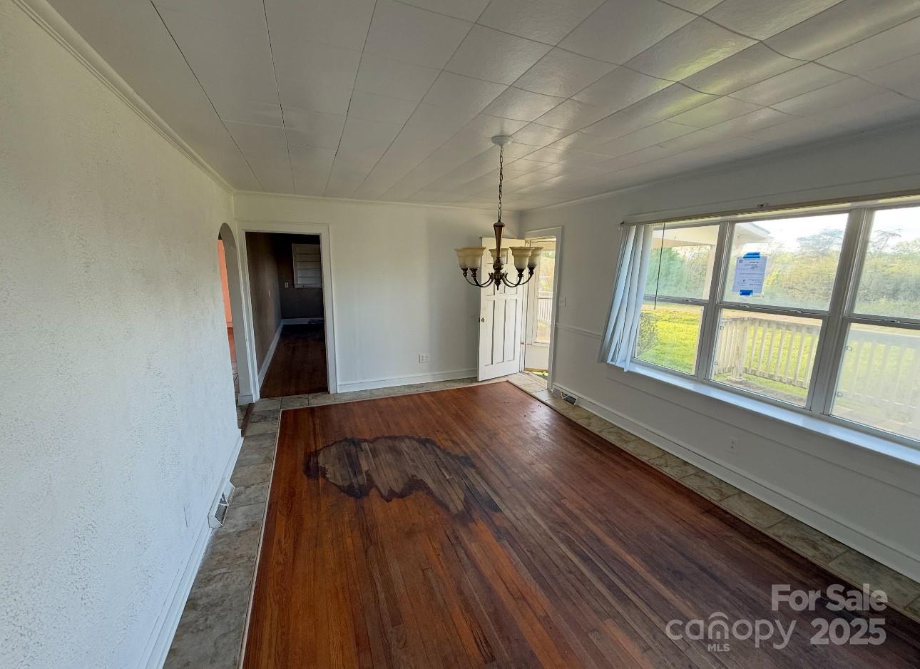 1088 Ramie Mitchell Road Hiddenite, NC 28636 - Photo 4 of 16 a view of an empty room and window