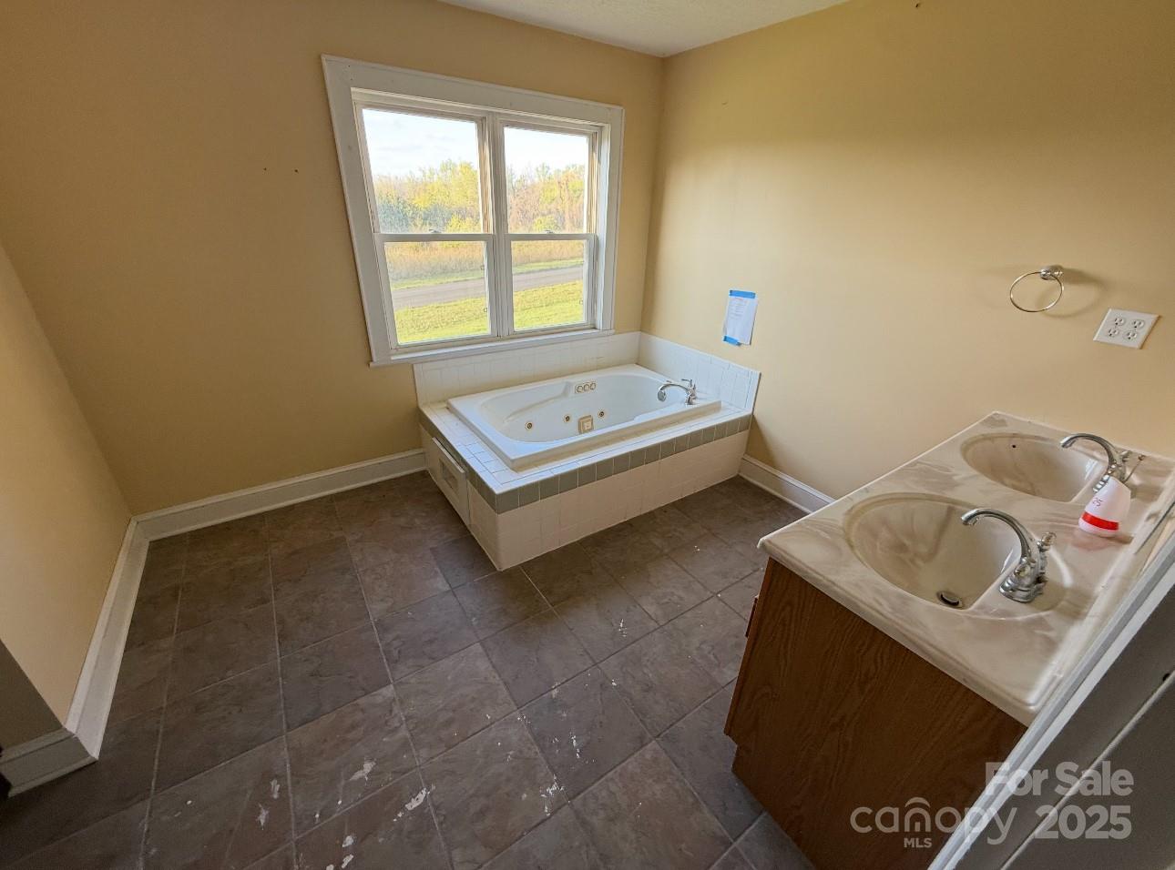 1088 Ramie Mitchell Road Hiddenite, NC 28636 - Photo 10 of 16 a bedroom with a bed and a window