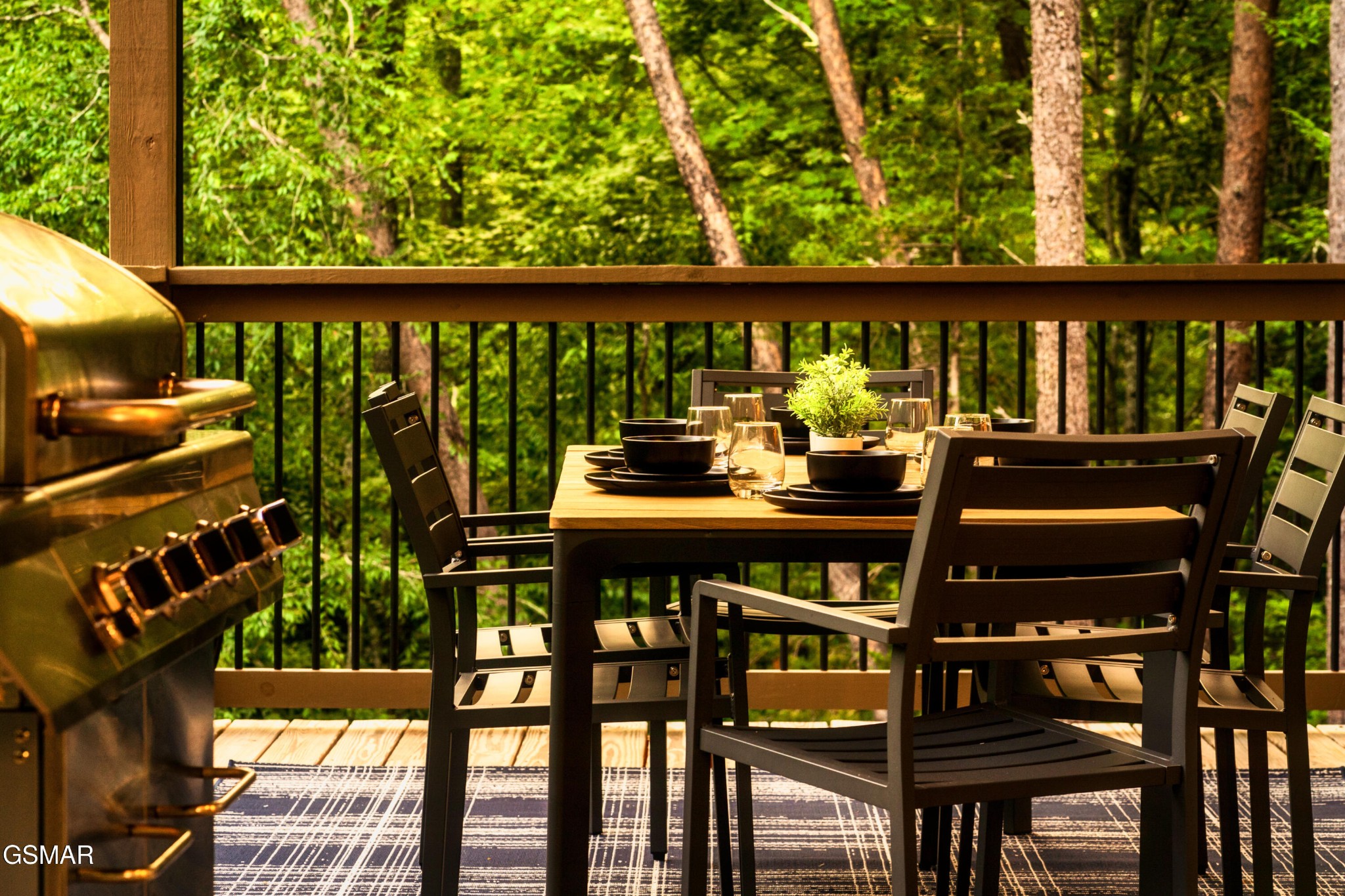 663 Lloyd Huskey Road Pigeon Forge, TN 37863 - Photo 24 of 80 a view of a balcony with wooden floor and outdoor seating
