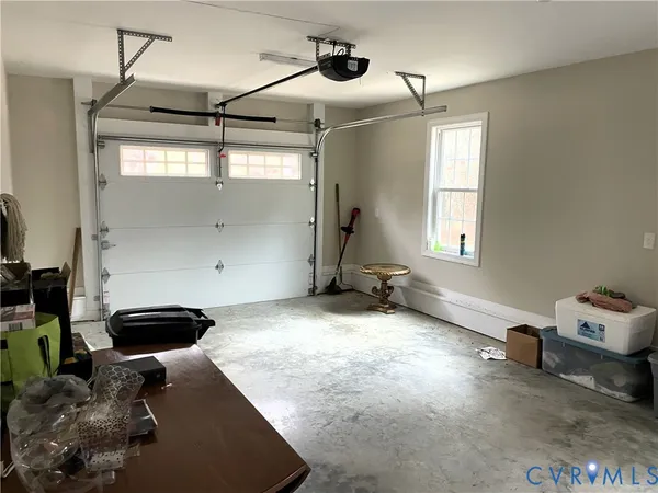 a room with a table and chairs