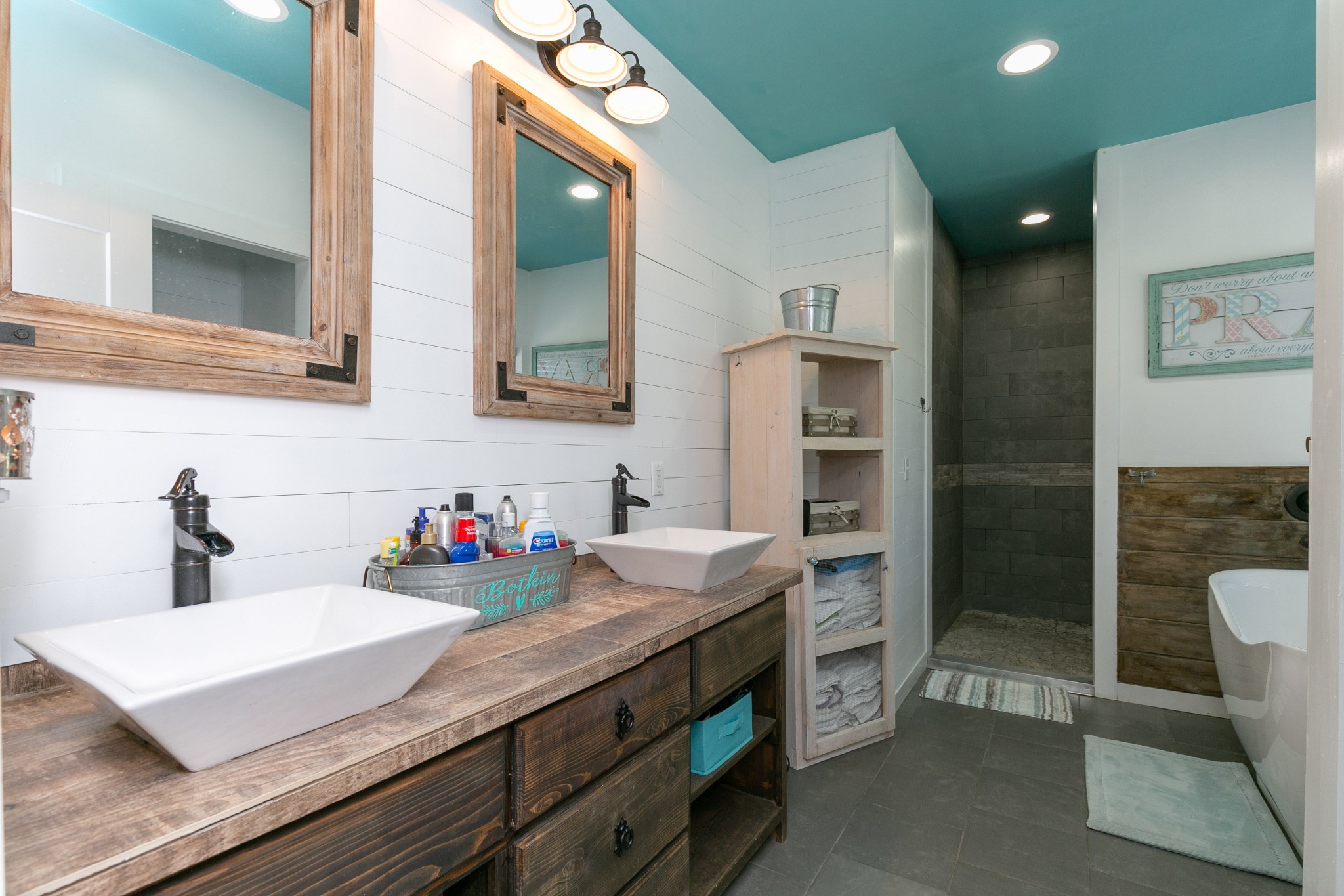 4920 Galen Road Lafayette, TN 37083 - Photo 20 of 47 a bathroom with a sink double vanity and a shower