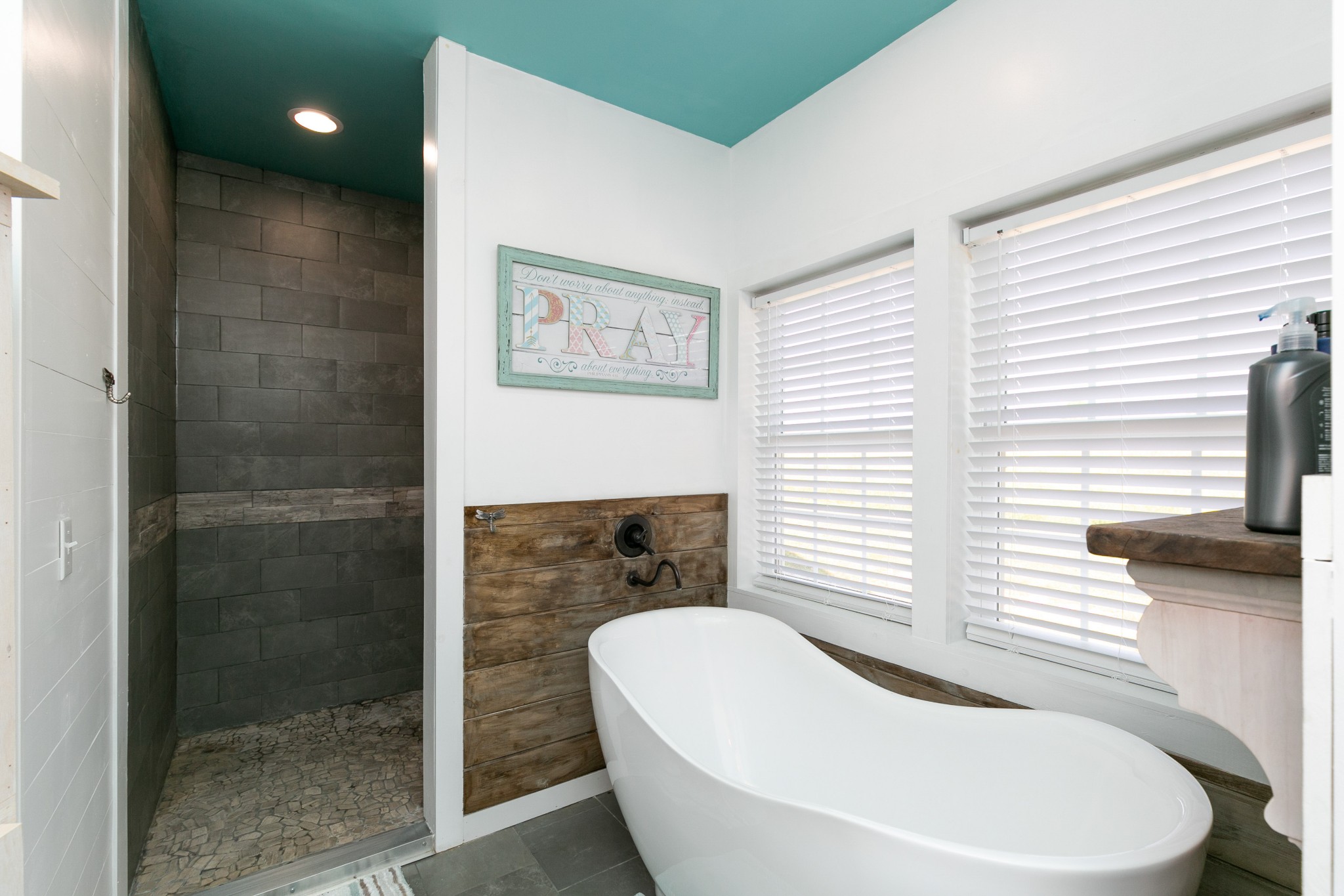 4920 Galen Road Lafayette, TN 37083 - Photo 21 of 47 a bathroom with a white tub shower and sink